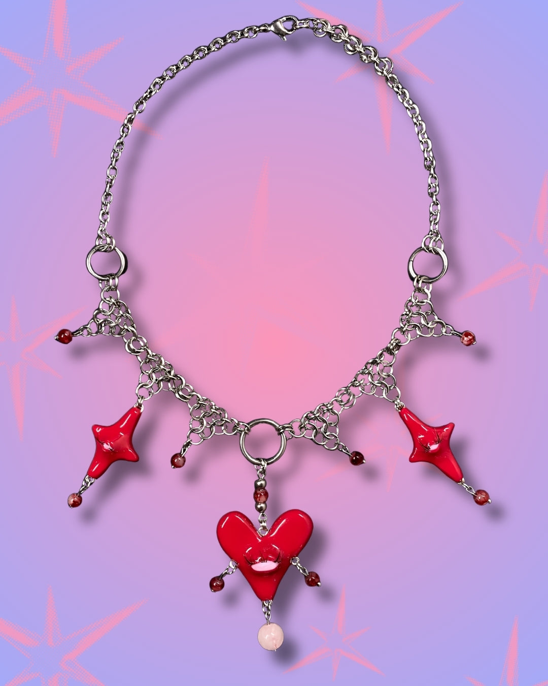 red heart creature necklace
