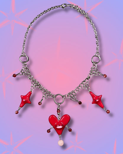red heart creature necklace