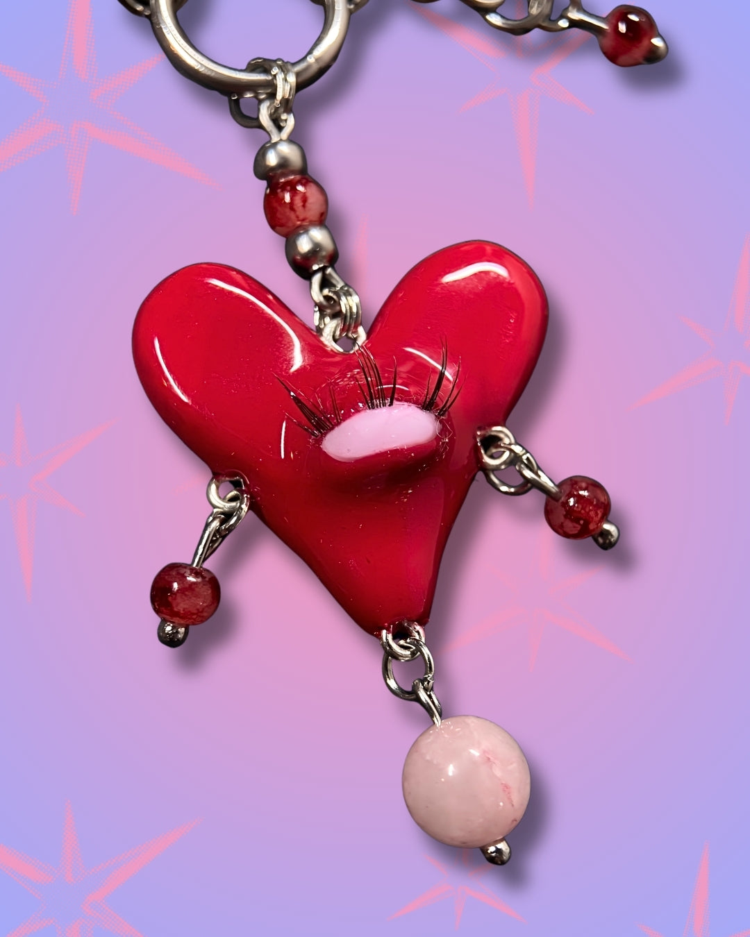 red heart creature necklace