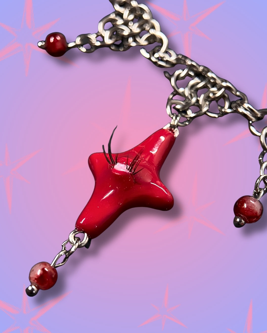 red heart creature necklace