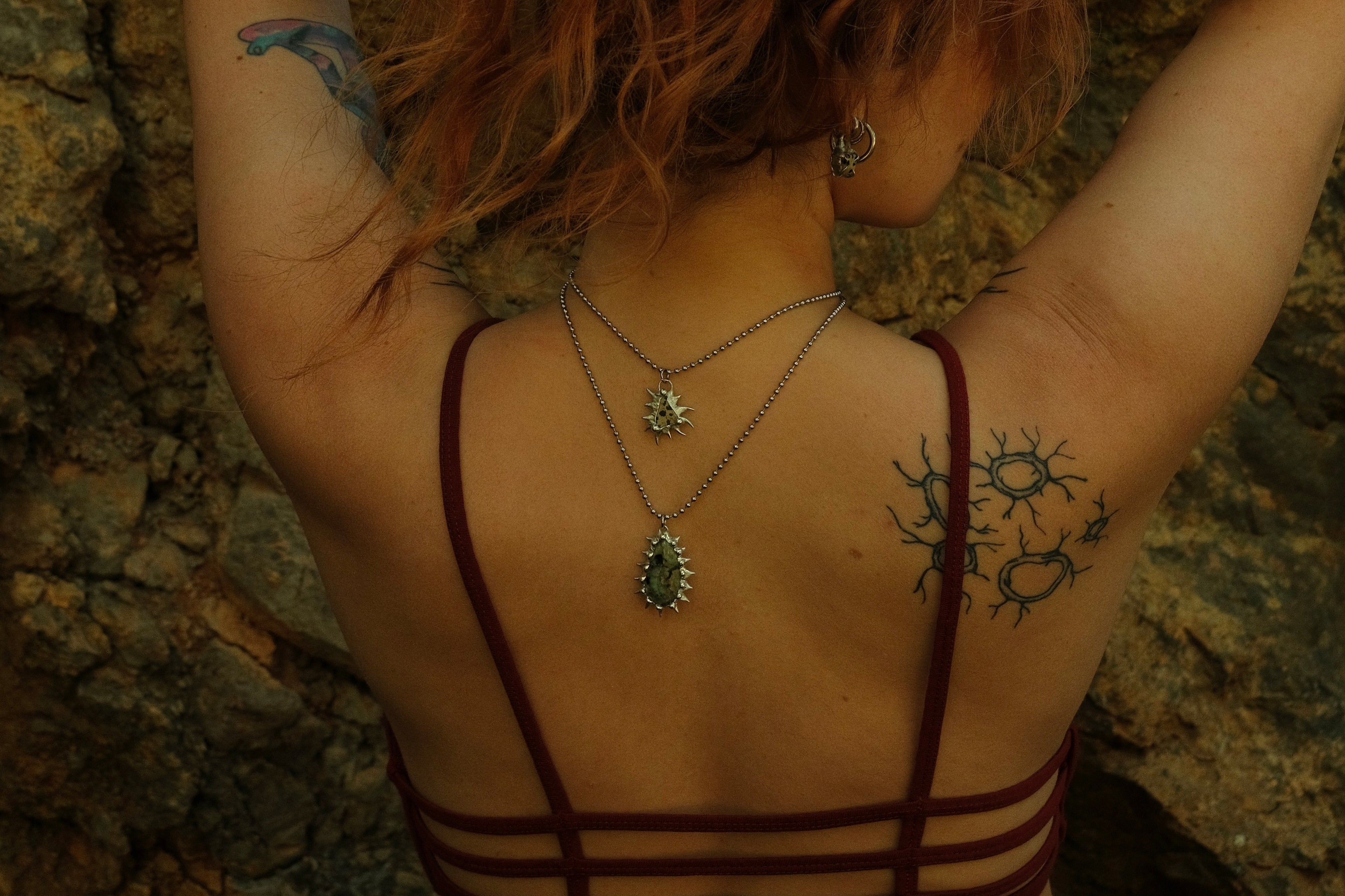 Handmade fair trade gemstone necklaces, spiked sterling silver pendant jewelry, eco-friendly lead-free solder, slow fashion model photo